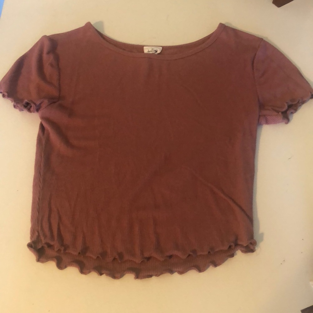 Maroon ribbed t shirt with lettuce trim.